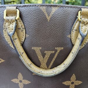 Handles of the OnTheGo PM showing finish loss and exposed layers from heavy use