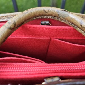 Red interior of the OnTheGo PM fitted with the included aftermarket red felt organizer
