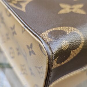 Corner of the OnTheGo PM showing light marks and rubbing on the giant monogram canvas
