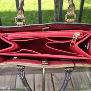 Interior of the OnTheGo PM with the aftermarket red felt organizer in place