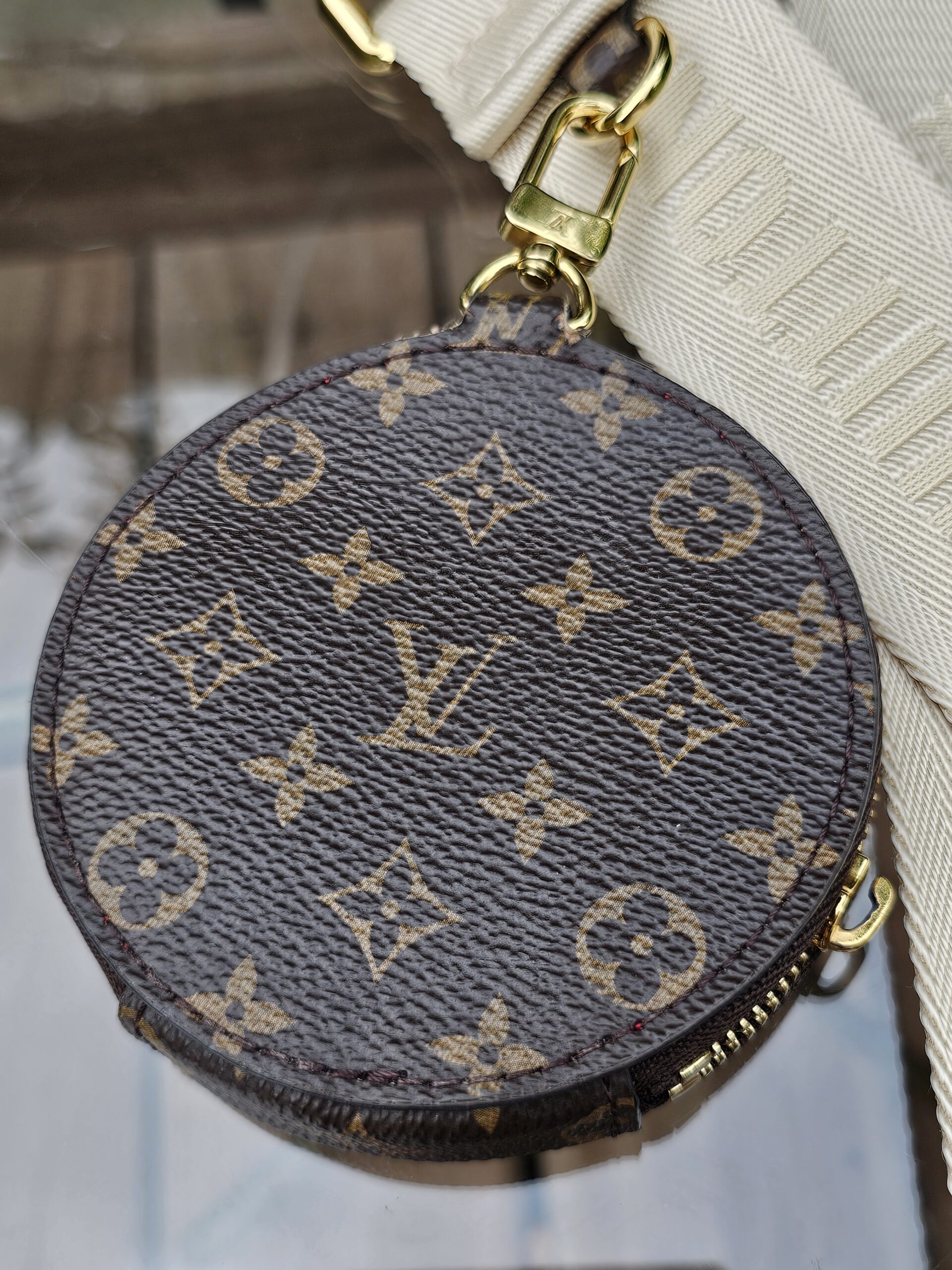 Reverse of the Monogram round pouch showing the canvas