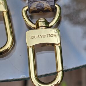 LOUIS VUITTON engraved gold-tone snap hook on the jacquard strap