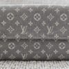 Louis Vuitton Monogram Mini Lin Sarah Wallet Gray - closed front view showing the woven gray monogram textile