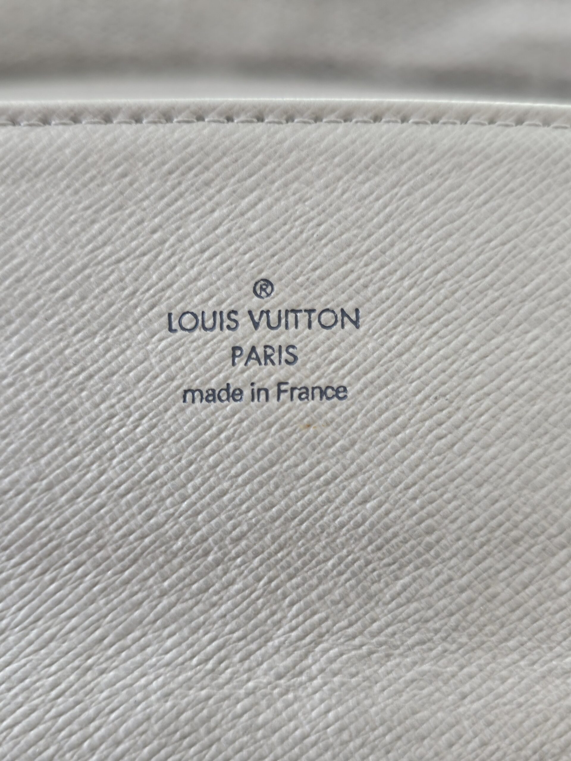 LOUIS VUITTON PARIS made in France stamp embossed inside the Mini Lin Sarah Wallet