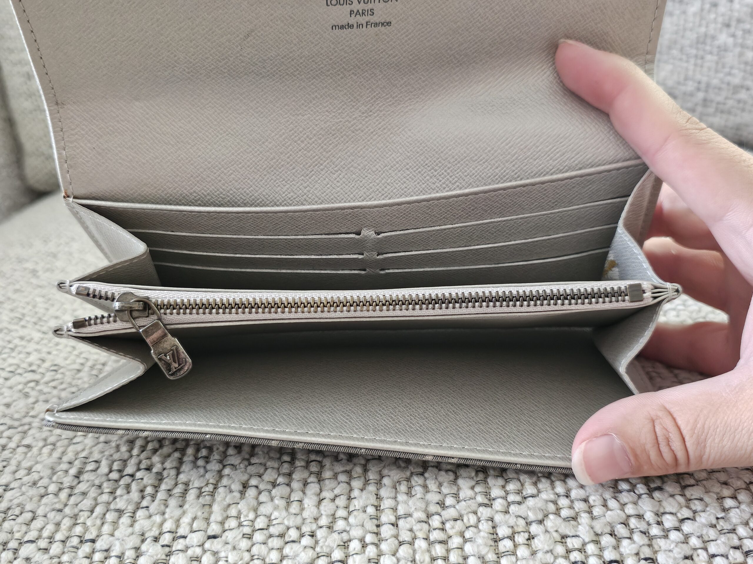 Gray Mini Lin Sarah Wallet opened to show the card slots and zipped coin compartment
