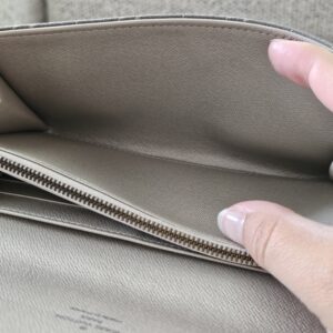 Interior lining of the gray Mini Lin Sarah Wallet, clean with light signs of use