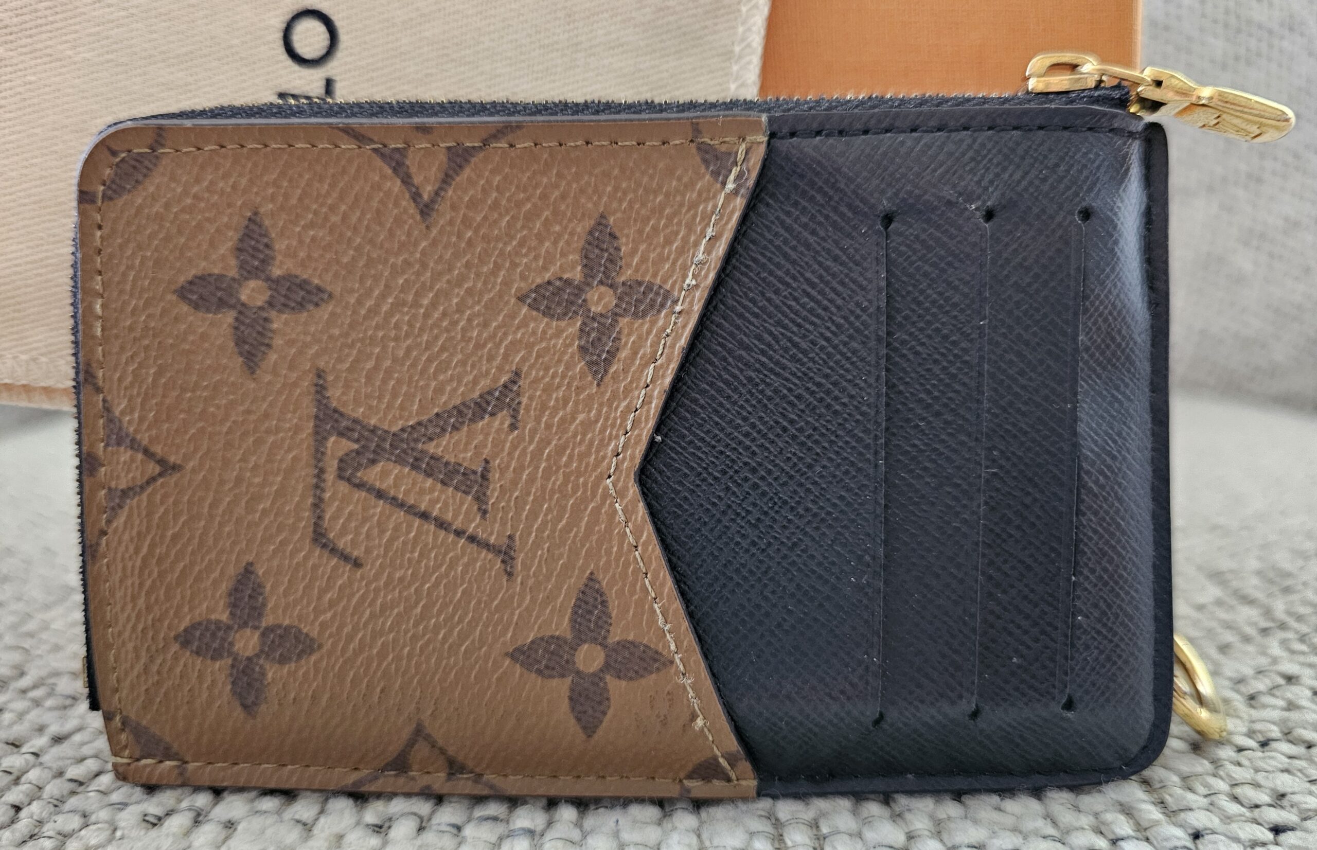 Reverse side of the Recto Verso card holder showing the three card slots against Monogram Reverse canvas