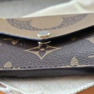 Envelope-style snap pocket on the front of the Monogram Reverse Recto Verso card holder