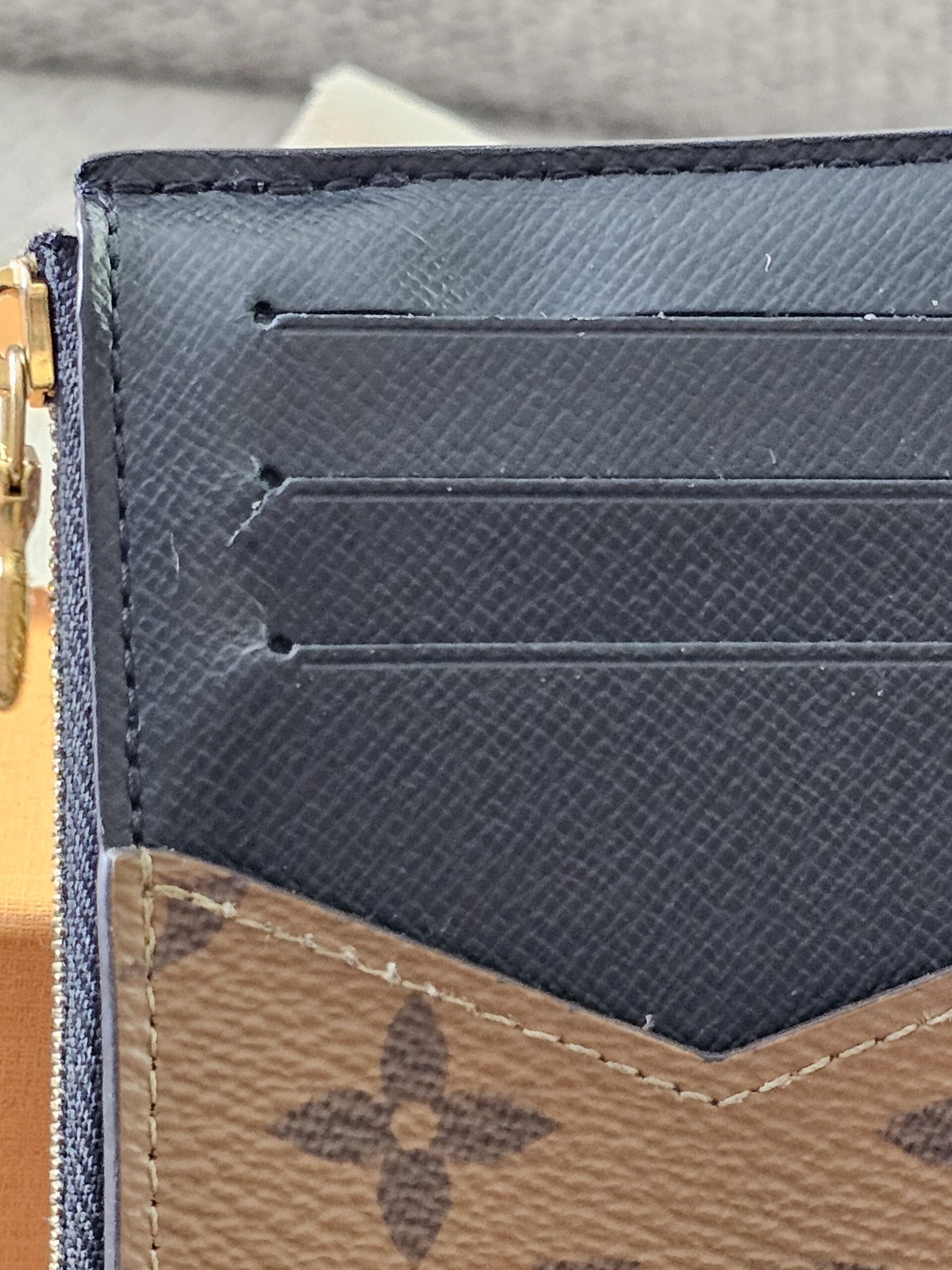 Close-up of the three card slots on the Monogram Reverse Recto Verso card holder