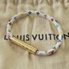 Louis Vuitton x Takashi Murakami Monogram Multicolor Confidential Bracelet White - shown on its dust bag