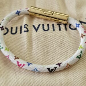 White Monogram Multicolor Confidential Bracelet showing the gold-tone barrel clasp