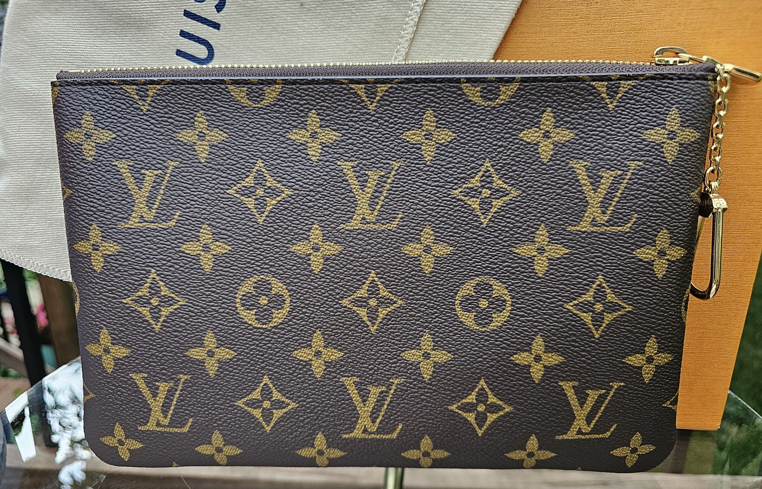 Reverse of the Monogram Key Pouch M showing the crisp coated canvas