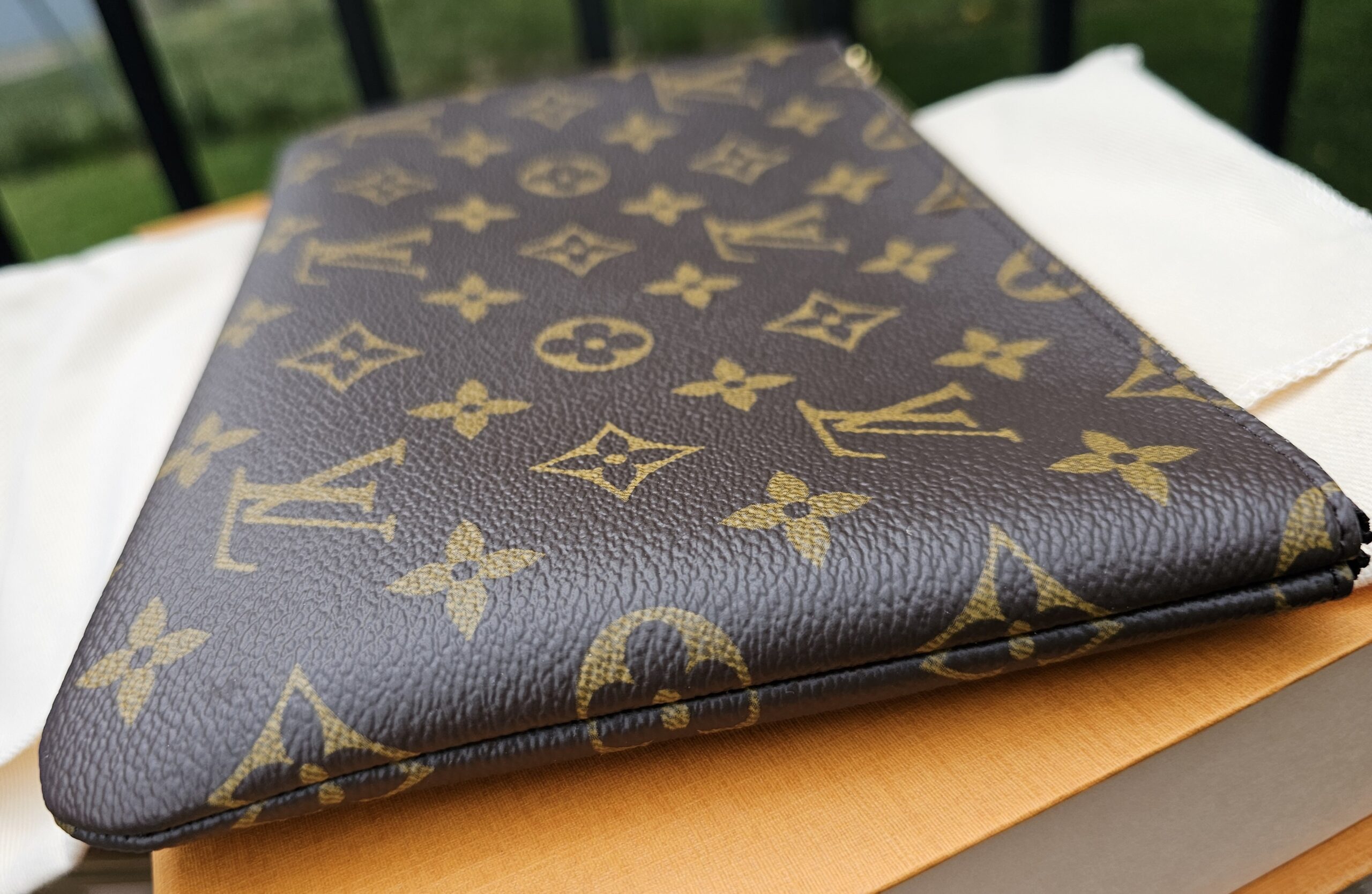 Corner of the Monogram Key Pouch M showing clean edges and no canvas cracking