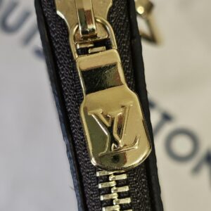 Gold-tone LV zip pull on the Monogram Key Pouch M