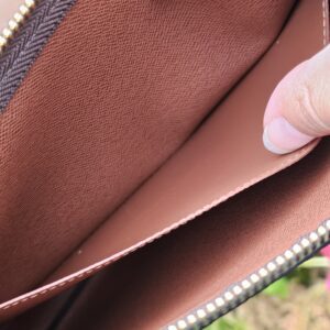 Brown cross-grain leather lining inside the Monogram Key Pouch M, pristine