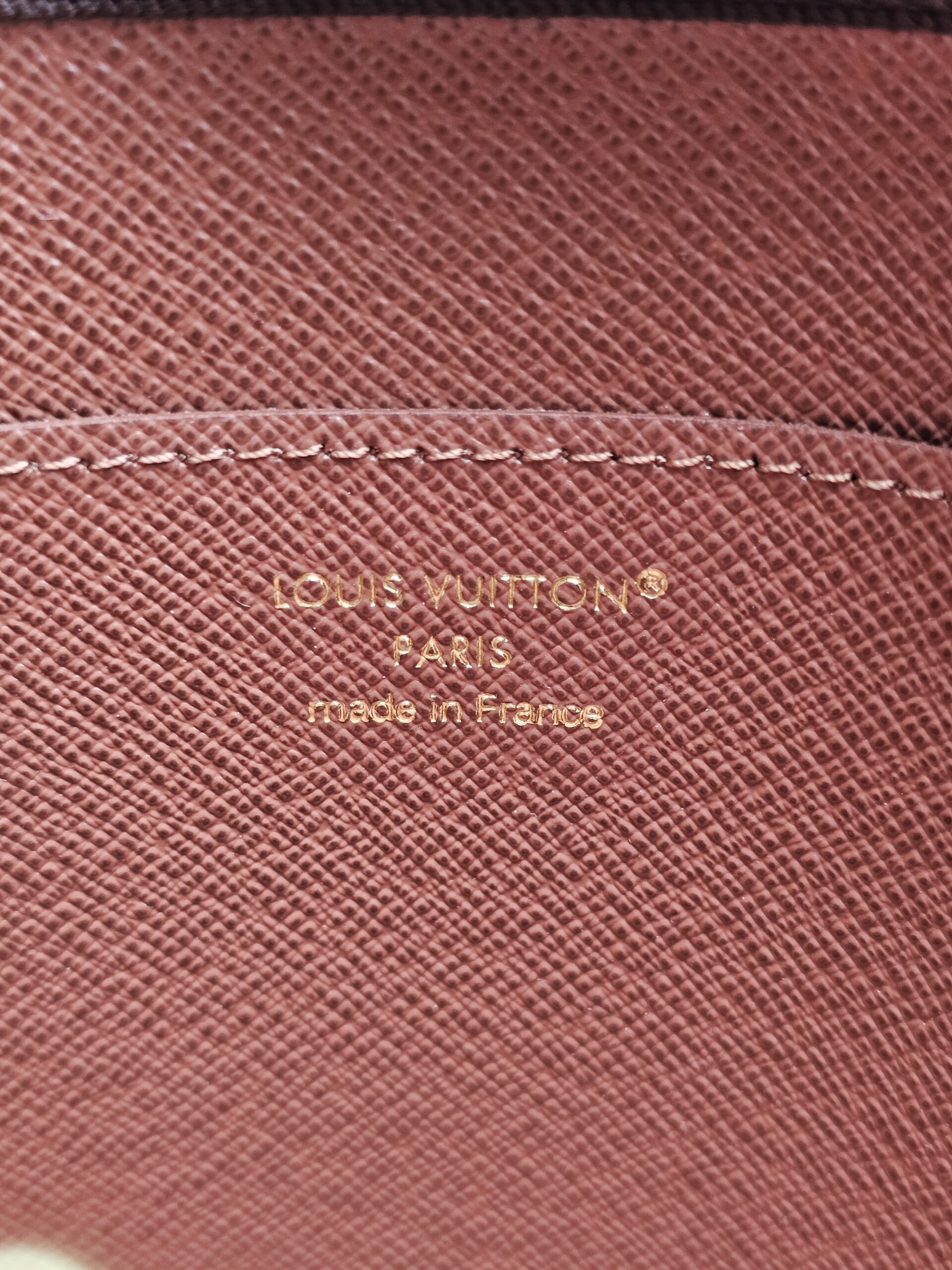LOUIS VUITTON PARIS made in France stamp inside the Monogram Key Pouch M
