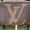 Louis Vuitton Monogram Giant Zippy Coin Purse - front view showing the oversized LV initials