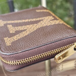 Gold-tone zip and edge of the Monogram Giant Zippy Coin Purse
