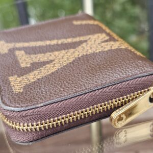 Close-up of the gold-tone zipper on the Louis Vuitton Monogram Giant Zippy Coin Purse