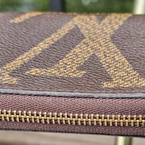 Profile of the Monogram Giant Zippy Coin Purse showing its compact depth