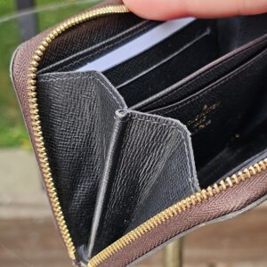 Card slots inside the black leather interior of the Monogram Giant Zippy Coin Purse