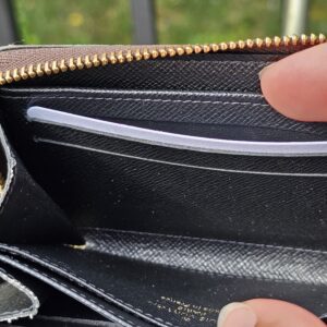 Black leather interior of the Monogram Giant Zippy Coin Purse, clean with light signs of use