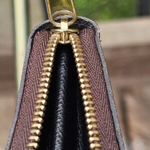 Zip-around closure of the Monogram Giant Zippy Coin Purse opened to show the interior