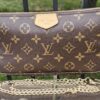 Louis Vuitton Monogram Multi Pochette Accessoires large pochette shown with the included gold-tone chain