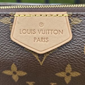 LOUIS VUITTON PARIS embossed vachetta name tag on the Monogram large pochette