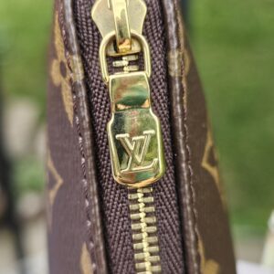 Gold-tone LV zip pull on the Monogram Multi Pochette Accessoires large pochette