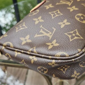 Side profile of the Monogram Multi Pochette Accessoires large pochette