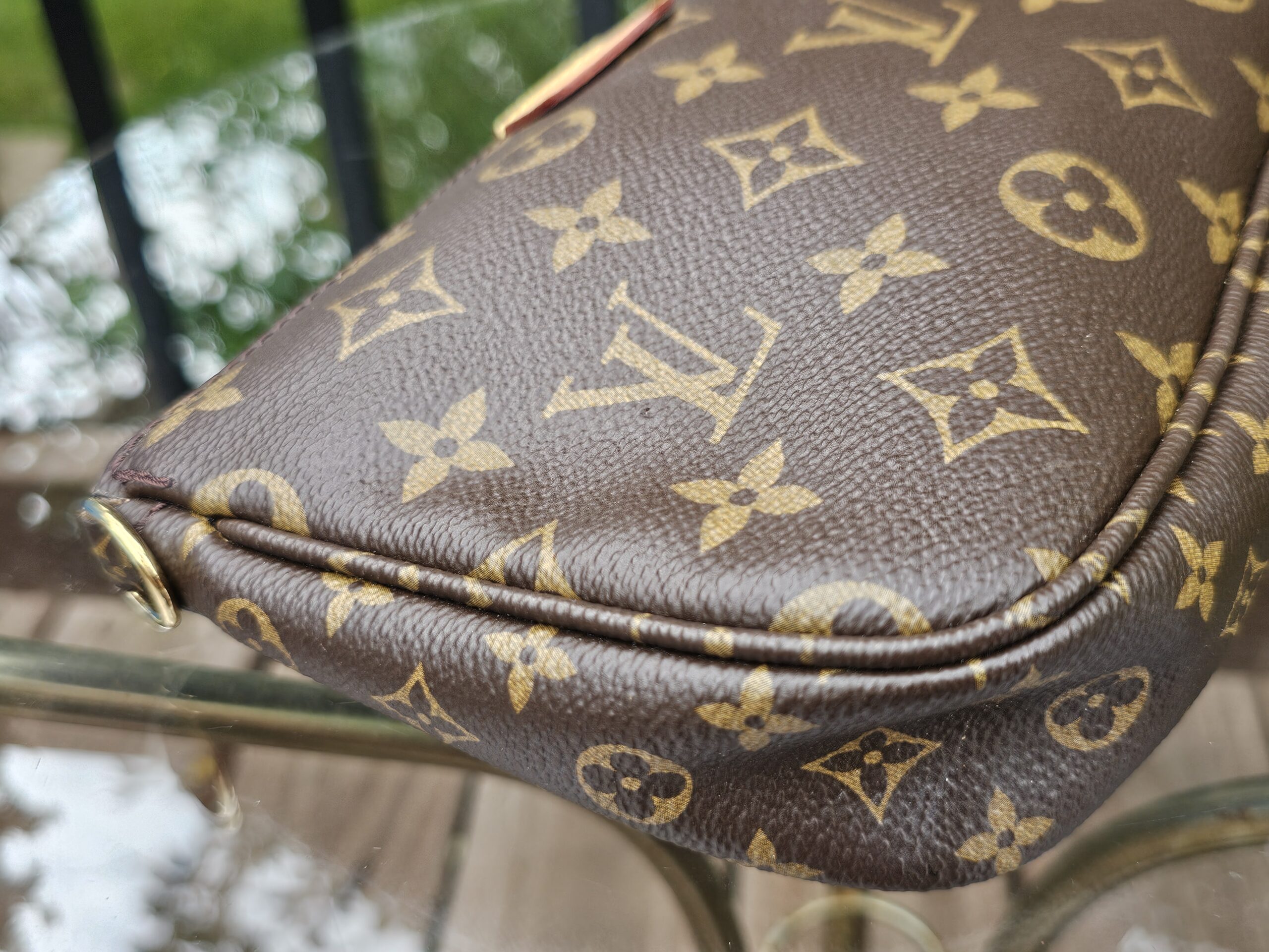 Side profile of the Monogram Multi Pochette Accessoires large pochette