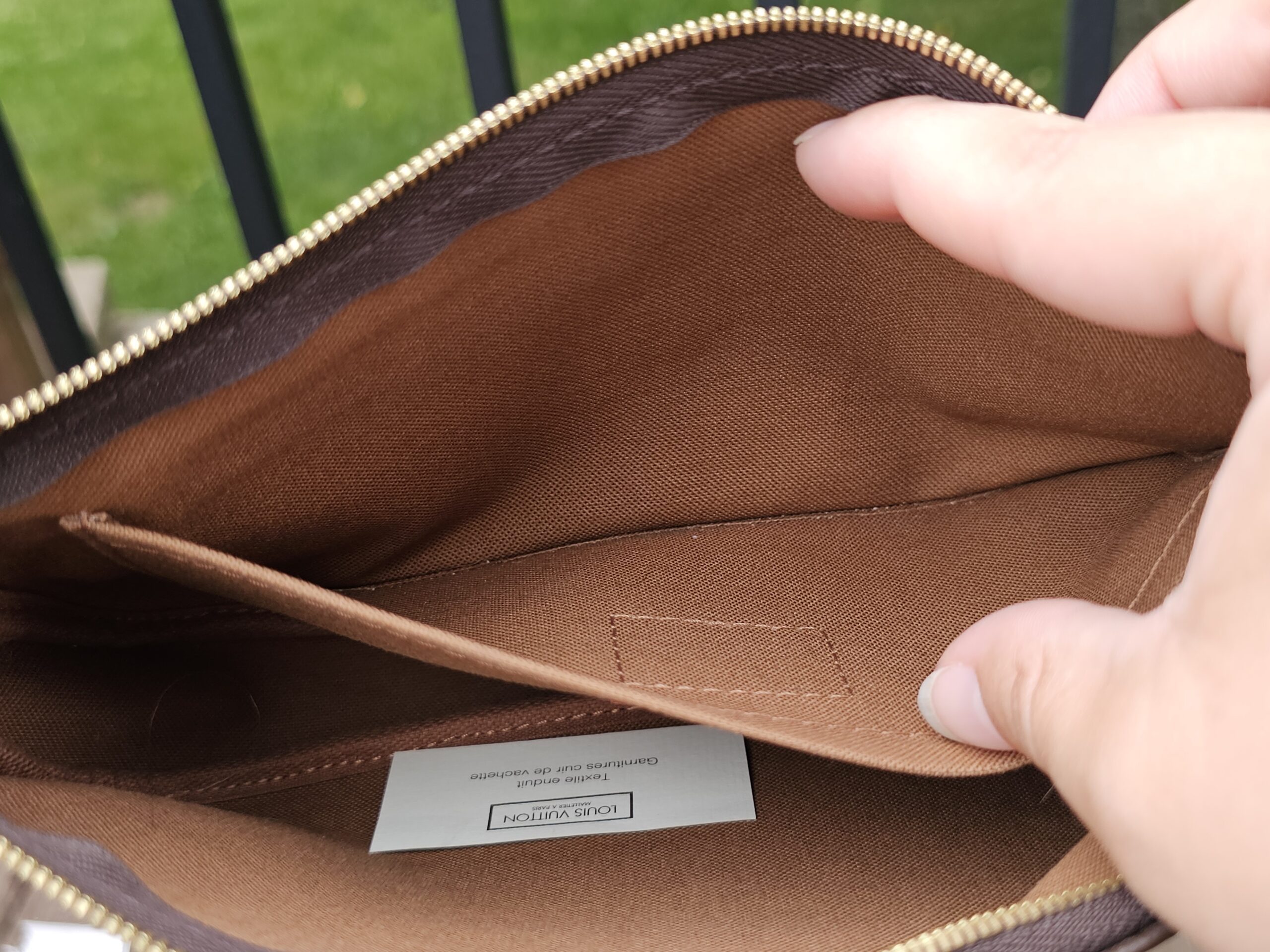 Brown interior lining of the Multi Pochette Accessoires large pochette