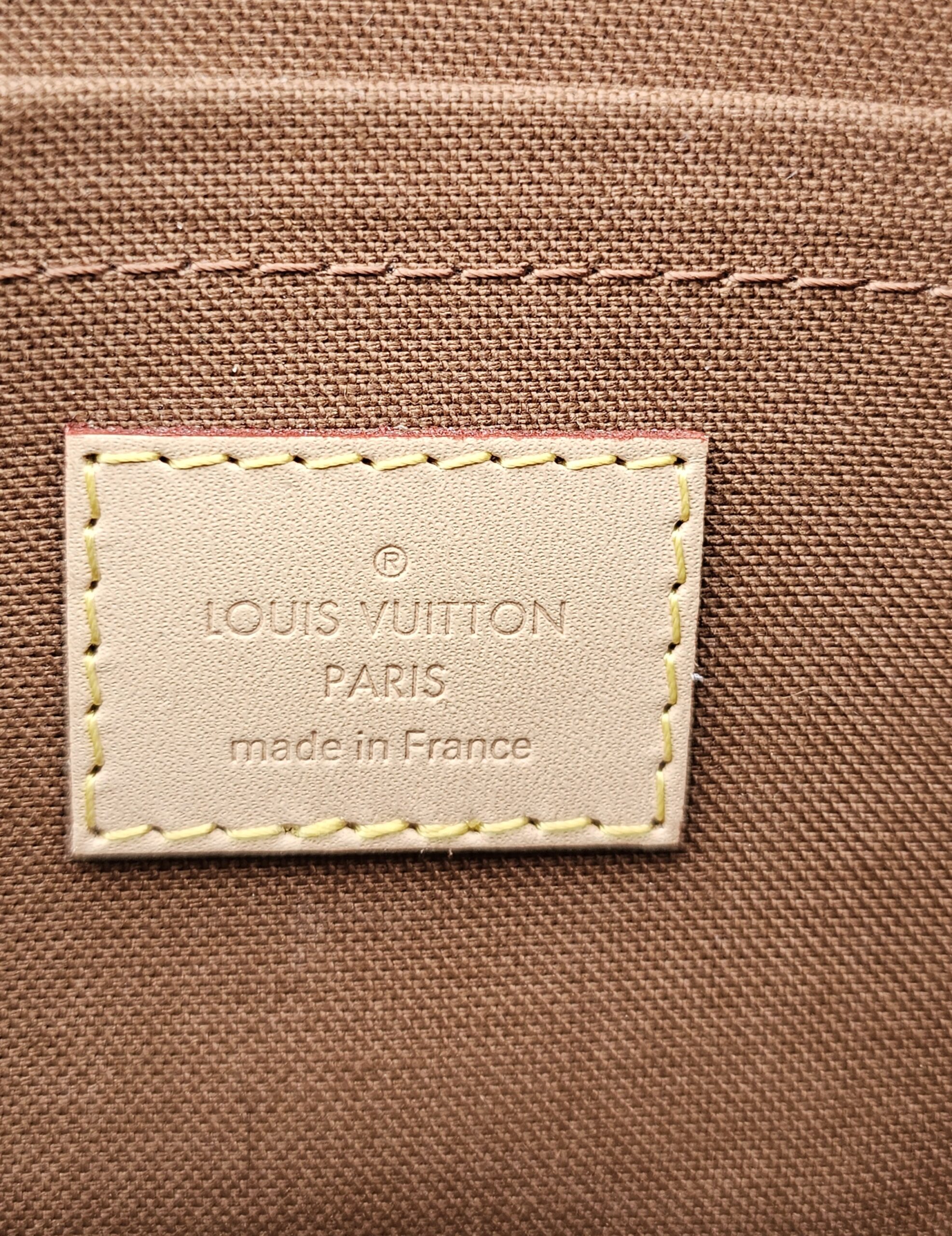 LOUIS VUITTON PARIS made in France tag stitched inside the Monogram large pochette