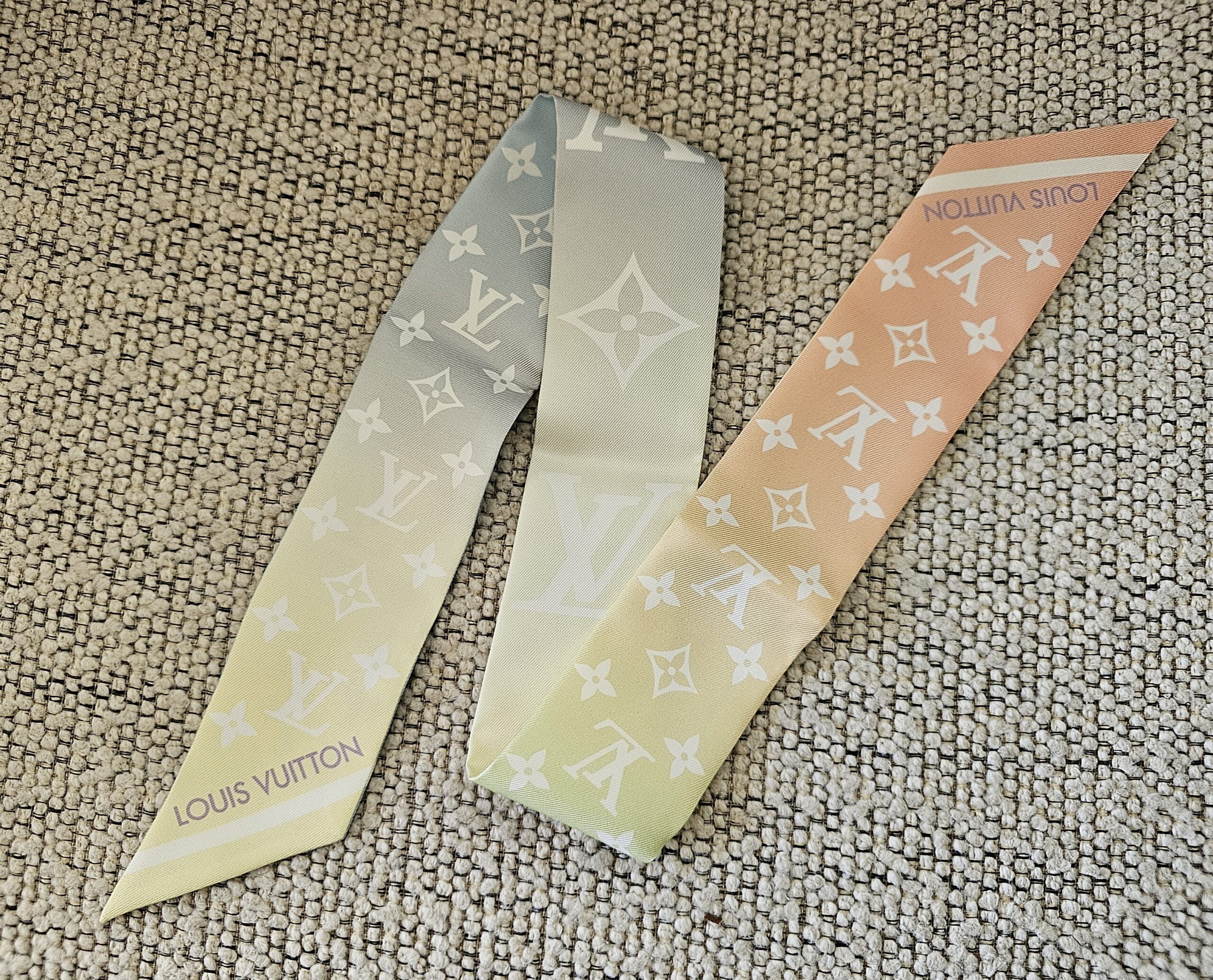 Louis Vuitton Silk LV Aurora Nano Bandeau - laid flat to show the pastel gradient and LOUIS VUITTON lettering