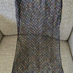 Full length of the sheer black Monogram Multicolor crepe silk scarf laid flat