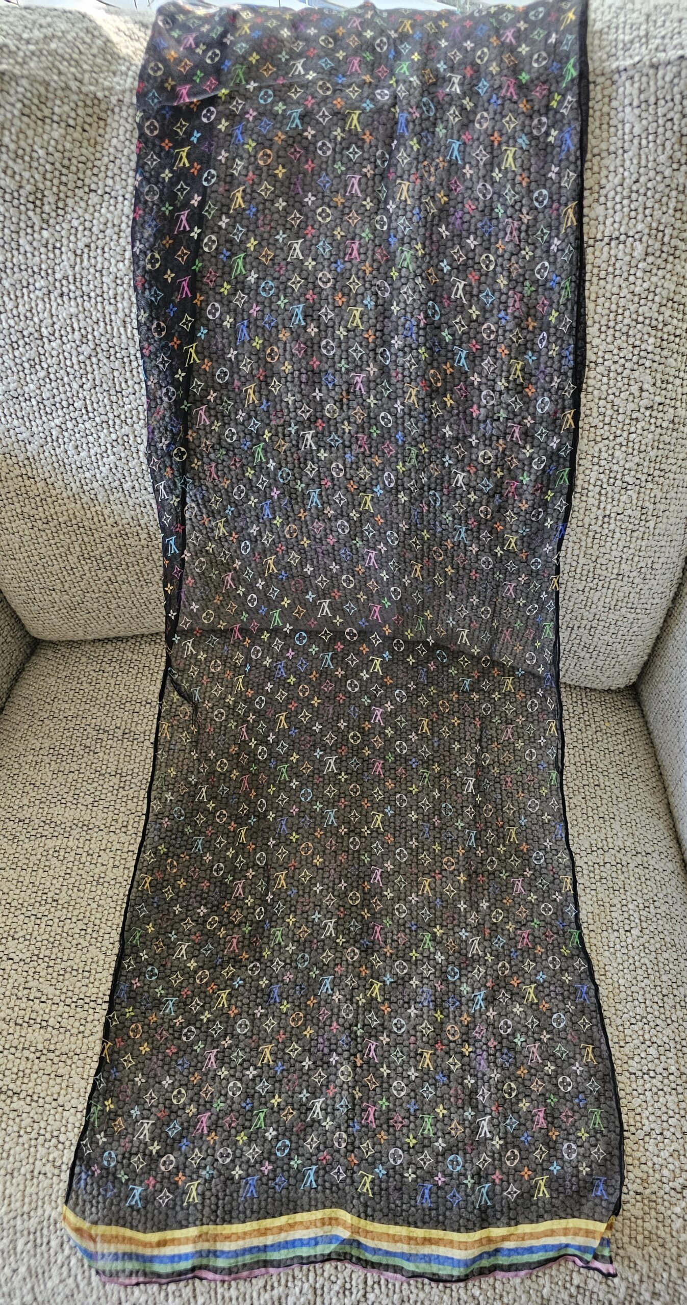 Full length of the sheer black Monogram Multicolor crepe silk scarf laid flat