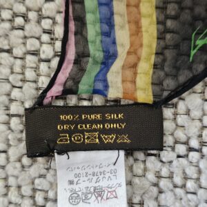 100% PURE SILK DRY CLEAN ONLY care label on the Louis Vuitton crepe scarf