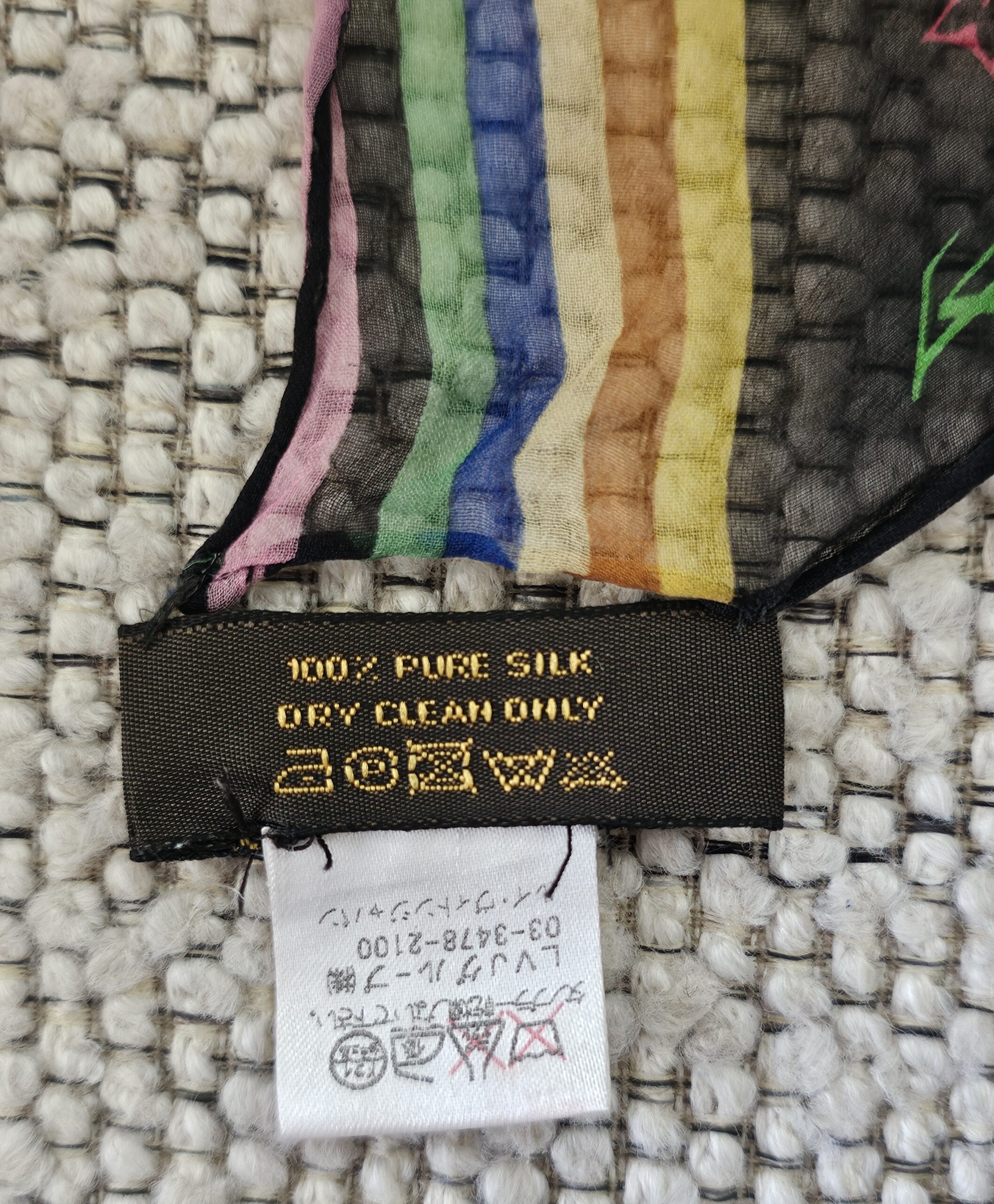 100% PURE SILK DRY CLEAN ONLY care label on the Louis Vuitton crepe scarf