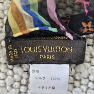 LOUIS VUITTON PARIS MADE IN ITALY label beside the multicolor striped border