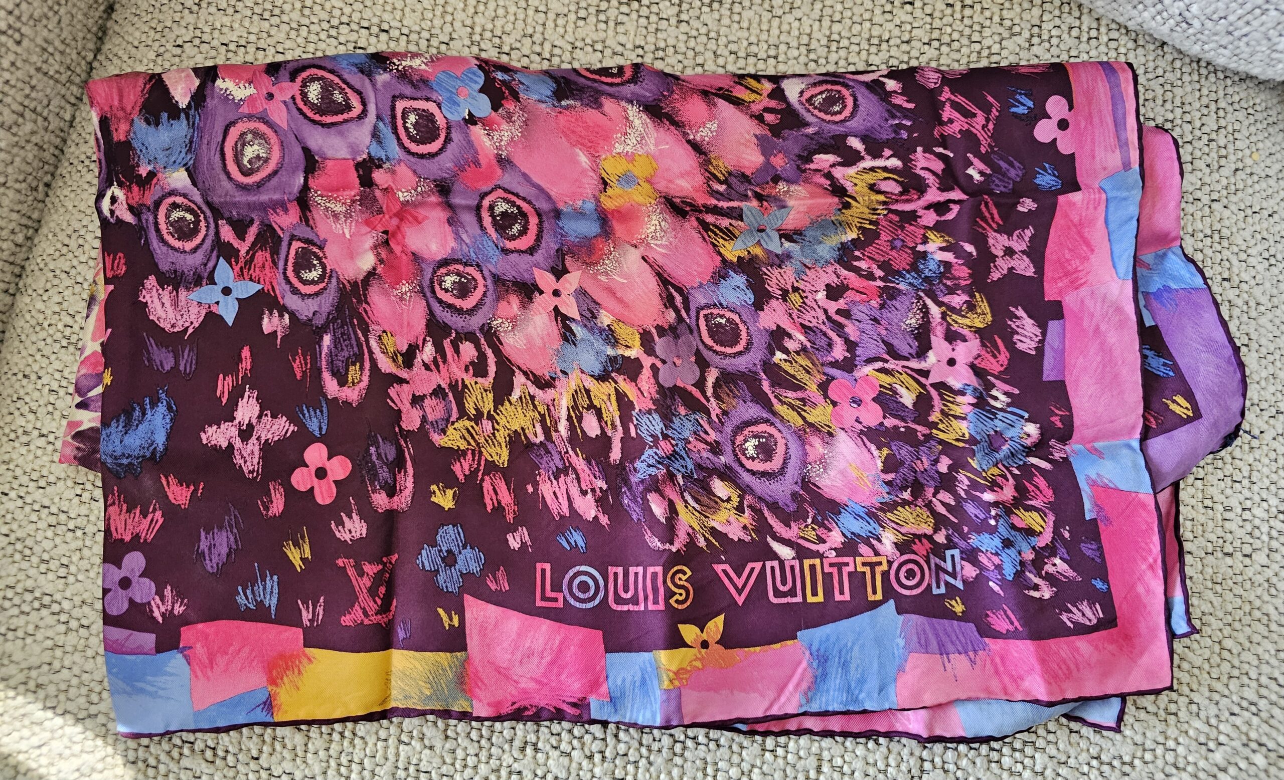 Paint Print Monogram scarf folded to show the LOUIS VUITTON border