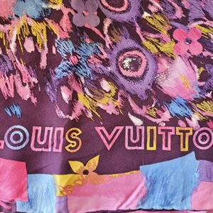 LOUIS VUITTON lettering in the painted border of the silk scarf