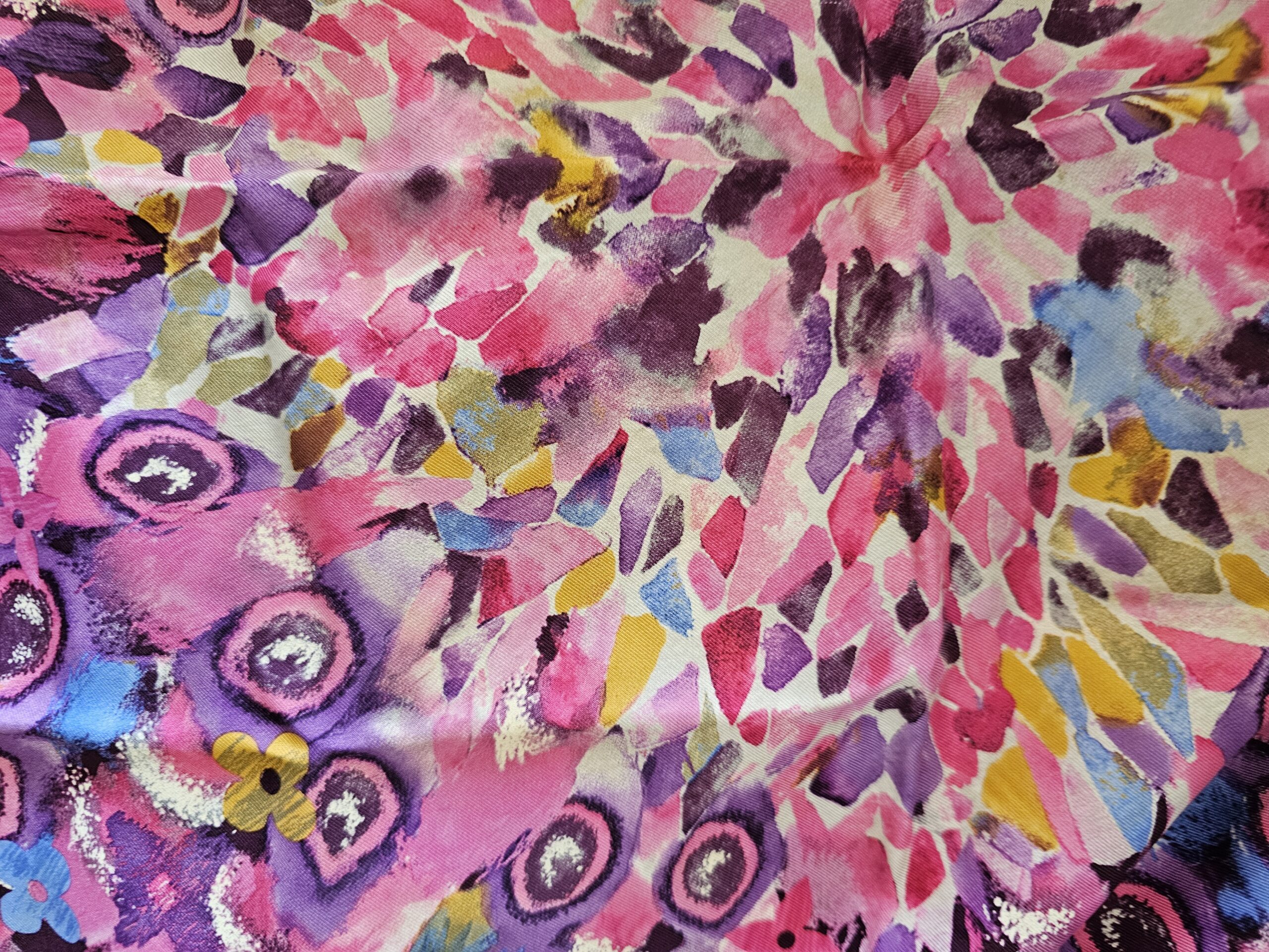 Close-up of the multicolor paint-inspired floral print on the silk
