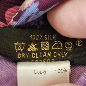 100% silk care label on the Paint Print Monogram scarf