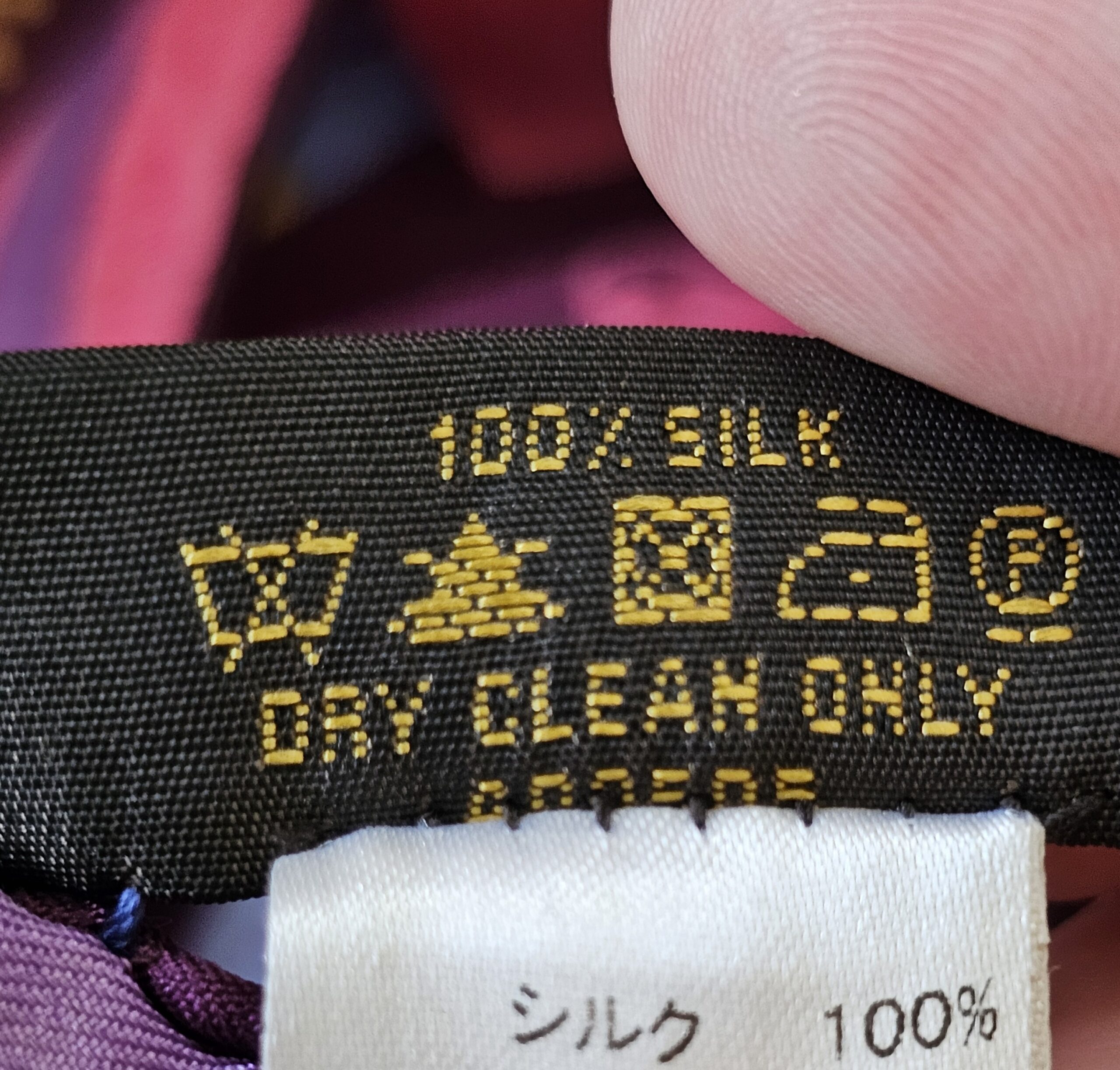Close-up of the 100% SILK DRY CLEAN ONLY care label