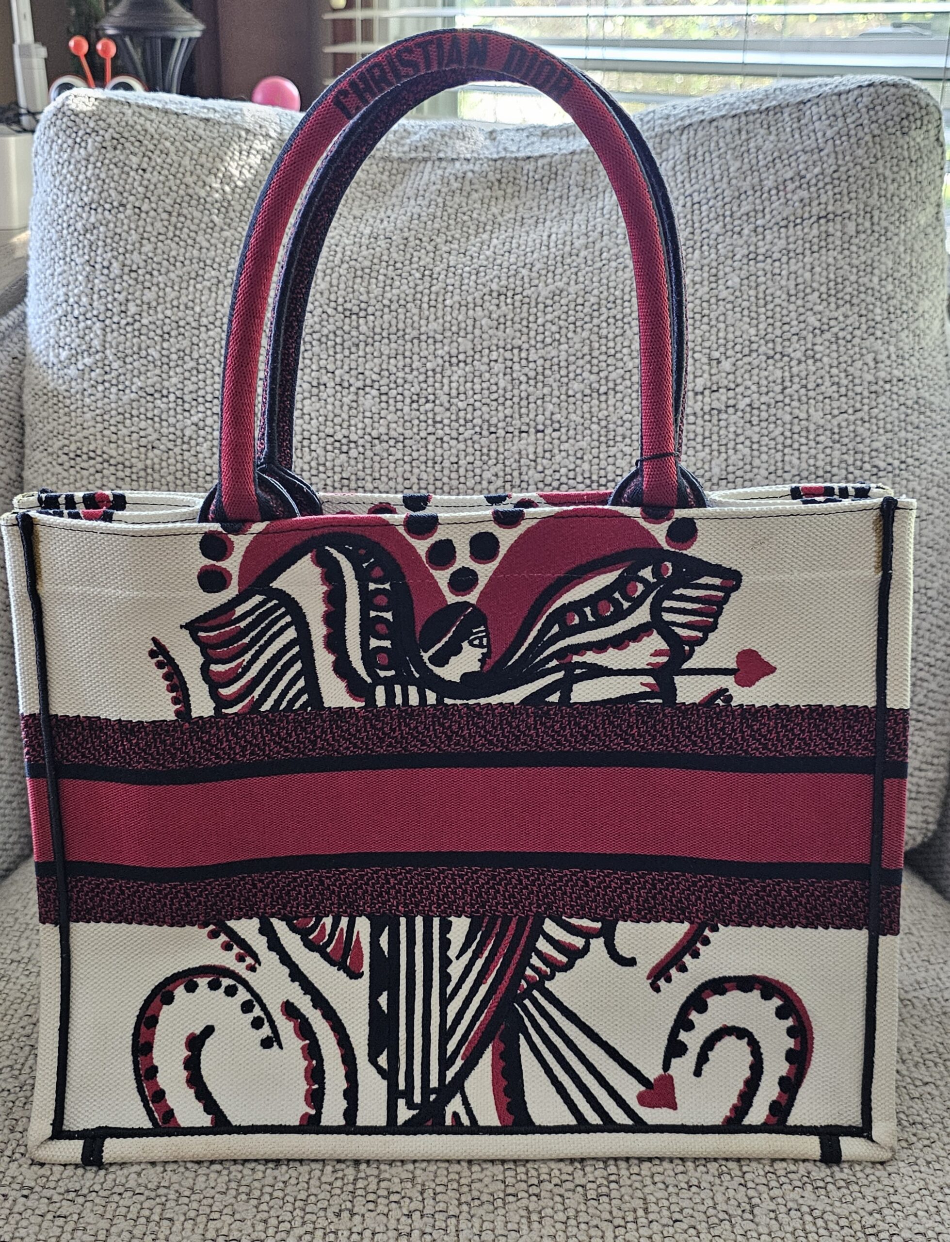 Reverse of the Dioramour D-Chess Heart Book Tote in red, black and white embroidery