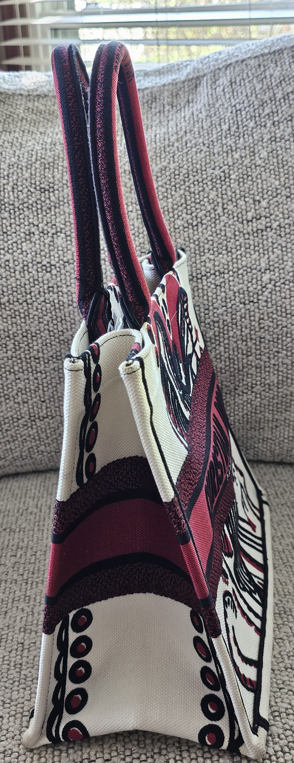 Side profile of the Christian Dior Dioramour Medium Book Tote