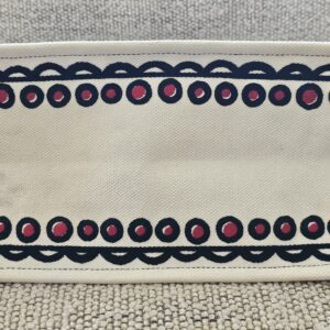 Base of the Christian Dior Dioramour Book Tote with the dotted border embroidery