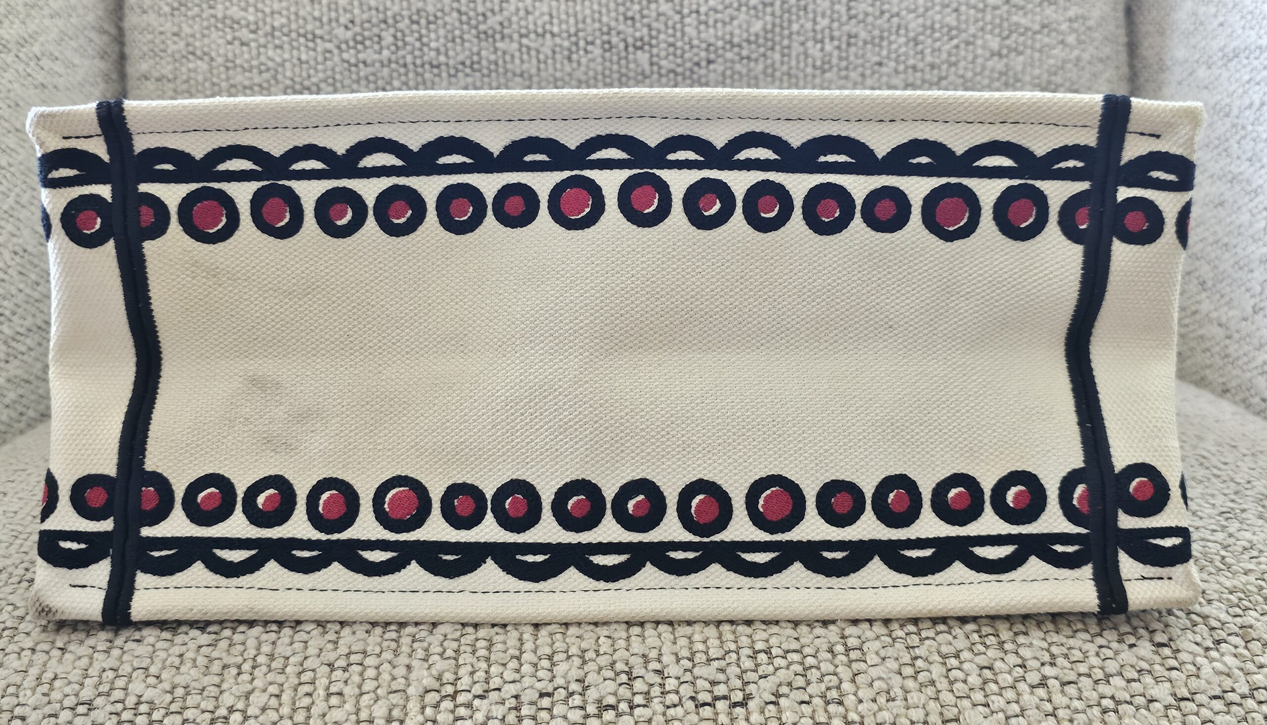 Base of the Christian Dior Dioramour Book Tote with the dotted border embroidery