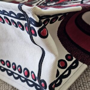 Lower corner of the Christian Dior Dioramour Book Tote with edge wear
